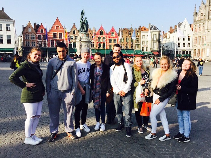 Students enjoy their time in the main square in Bruges